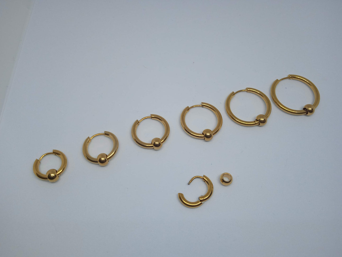 Argola Bola Aço Dourado